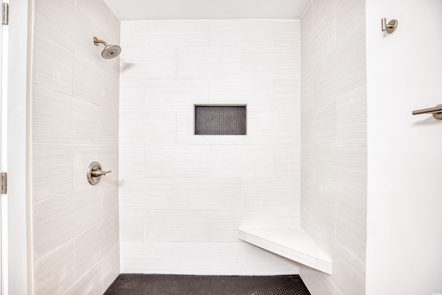 bathroom featuring tiled shower