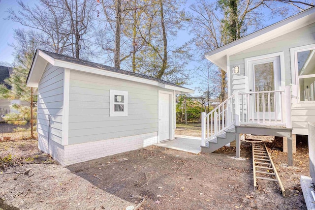 view of side of property featuring an outbuilding