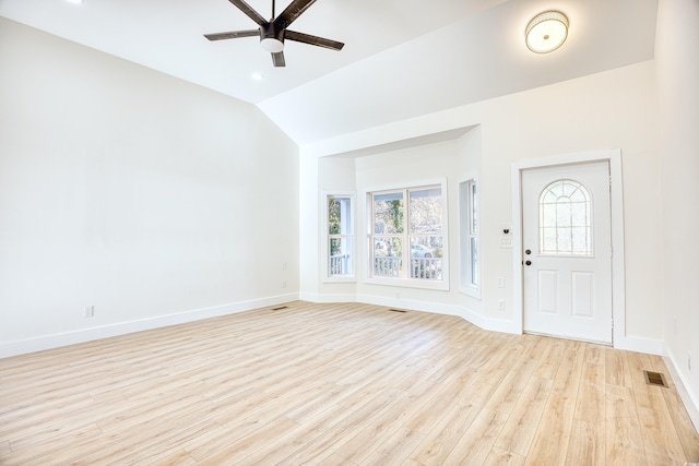 entryway featuring vaulted ceiling, light wood finished floors, visible vents, and baseboards