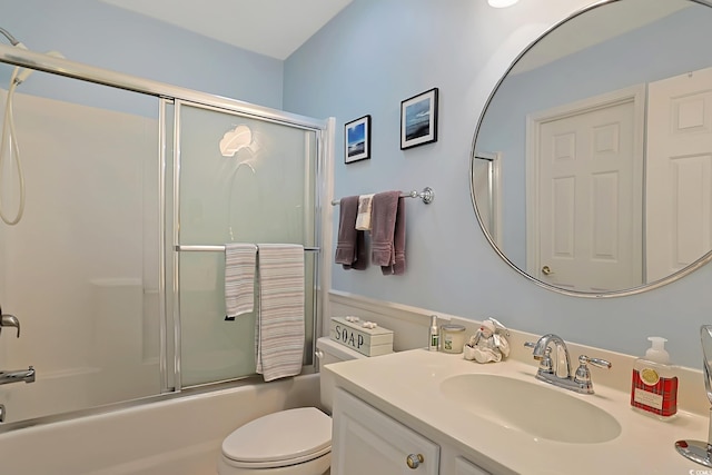 full bathroom featuring vanity, toilet, and enclosed tub / shower combo