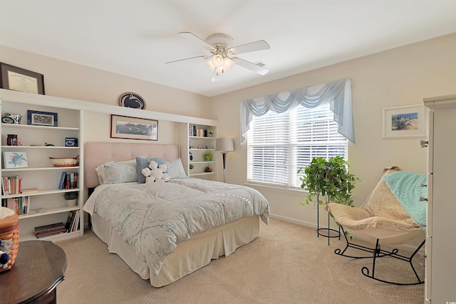 carpeted bedroom featuring ceiling fan