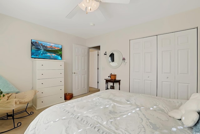 bedroom featuring ceiling fan and a closet