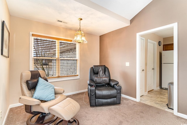 living area with light colored carpet and lofted ceiling