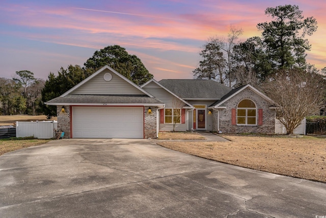 ranch-style home with a garage