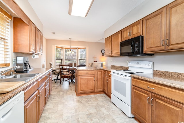 kitchen with kitchen peninsula, light stone countertops, white appliances, a chandelier, and hanging light fixtures