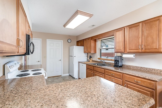 kitchen featuring white appliances and sink