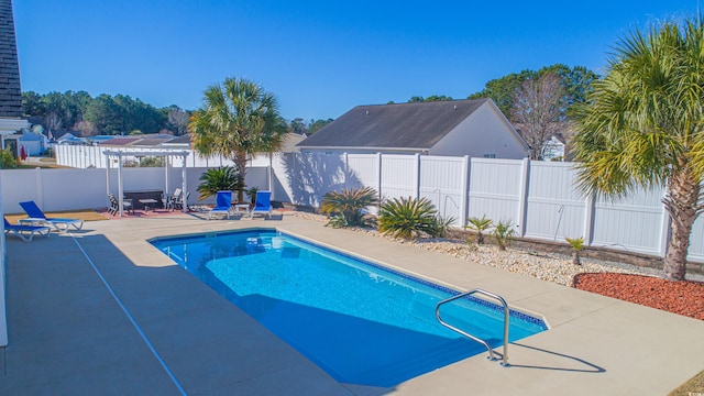 view of swimming pool featuring a patio