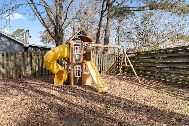 view of jungle gym featuring fence