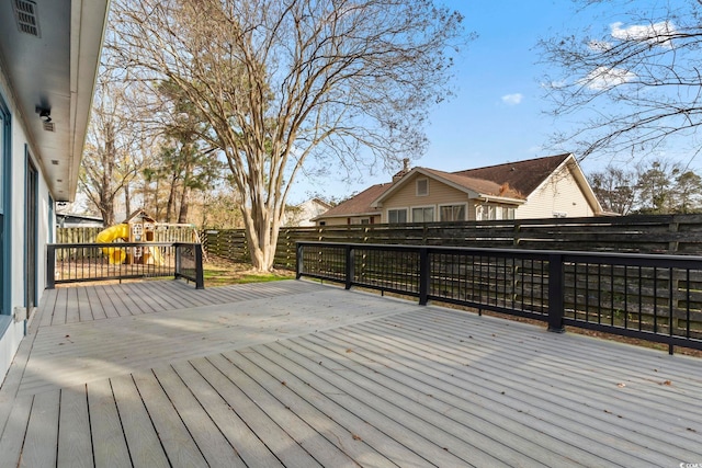 wooden terrace featuring a fenced backyard