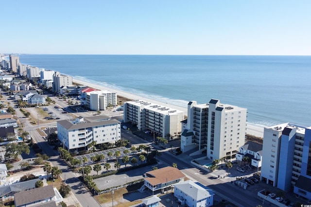 birds eye view of property with a view of the beach and a water view