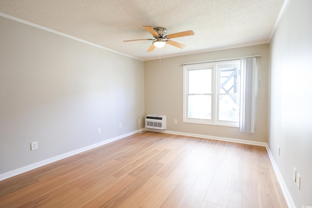 unfurnished room featuring a textured ceiling, light hardwood / wood-style flooring, ceiling fan, and ornamental molding