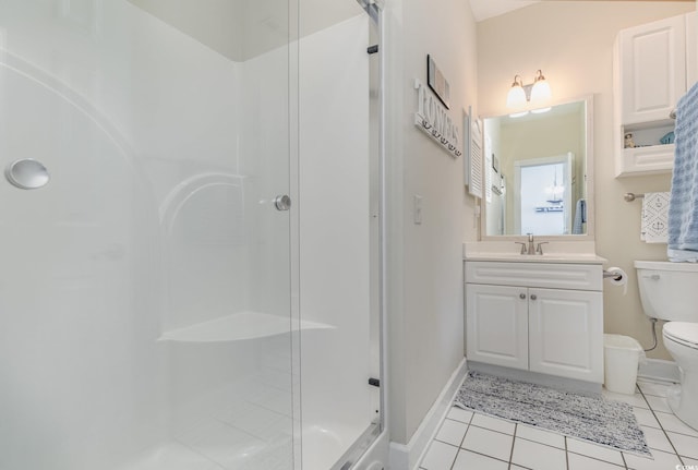 bathroom featuring toilet, vanity, tile patterned floors, and an enclosed shower