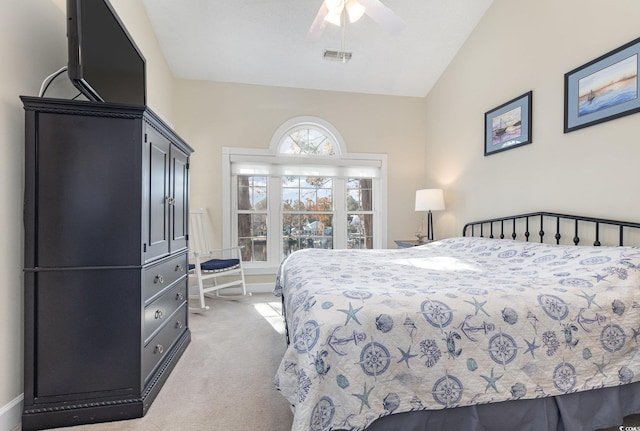 carpeted bedroom with vaulted ceiling and ceiling fan