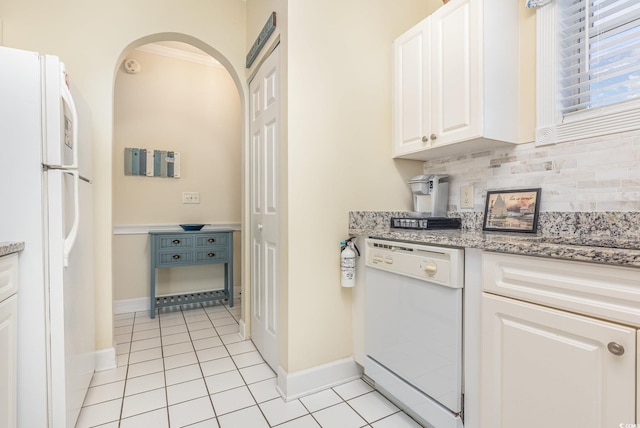 kitchen with white appliances, white cabinets, decorative backsplash, ornamental molding, and light tile patterned flooring