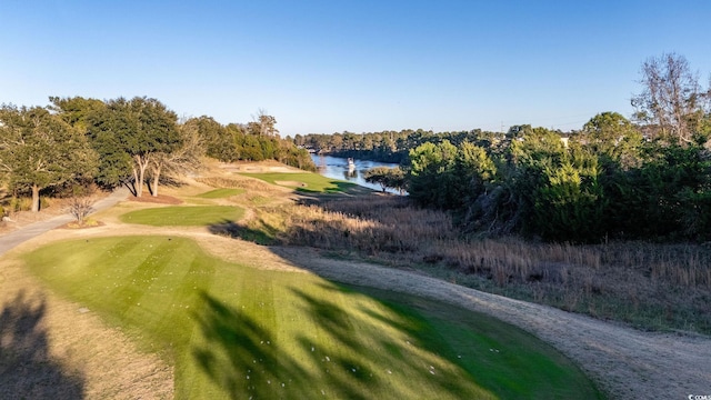 surrounding community with a water view