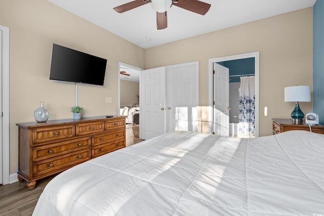 bedroom featuring wood-type flooring and ceiling fan