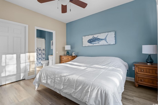 bedroom featuring light hardwood / wood-style floors, ensuite bath, and ceiling fan