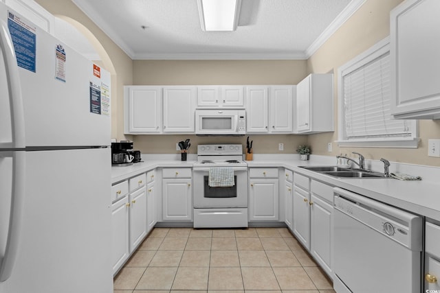 kitchen with white cabinetry, a textured ceiling, white appliances, light tile patterned floors, and ornamental molding