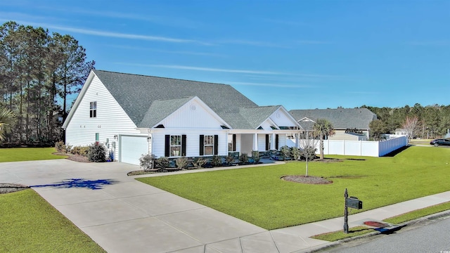 modern farmhouse with a garage and a front lawn