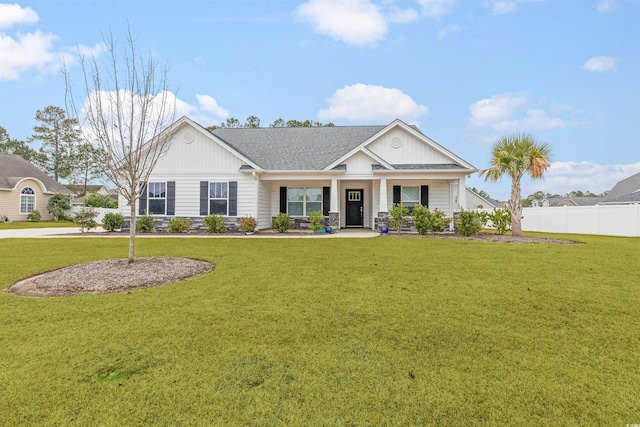 view of front facade featuring a front yard and a porch