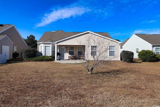 view of front of property with a porch and a front lawn