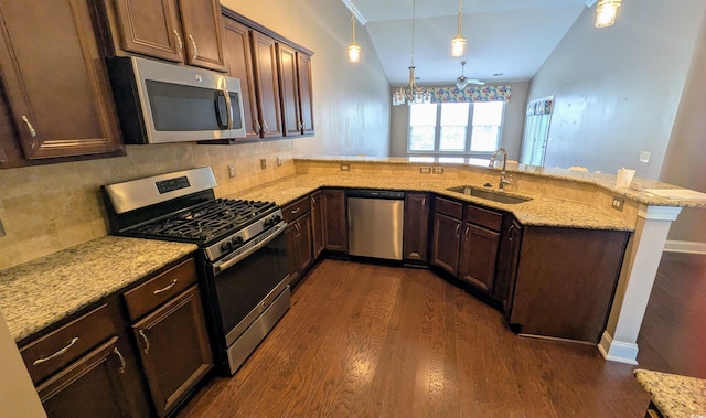 135 Parmelee Dr Unit D, Murrells Inlet, SC 29576 - kitchen with stainless steel appliances, a sink, vaulted ceiling, dark wood-type flooring, and a peninsula