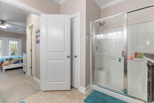 135 Parmelee Dr Unit D, Murrells Inlet, SC 29576 - ensuite bathroom featuring ornamental molding, a stall shower, ceiling fan, baseboards, and tile patterned floors