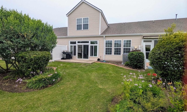 135 Parmelee Dr Unit D, Murrells Inlet, SC 29576 - back of property with a patio area, a yard, a shingled roof, and cooling unit