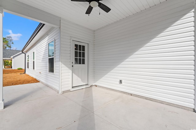 view of patio featuring ceiling fan