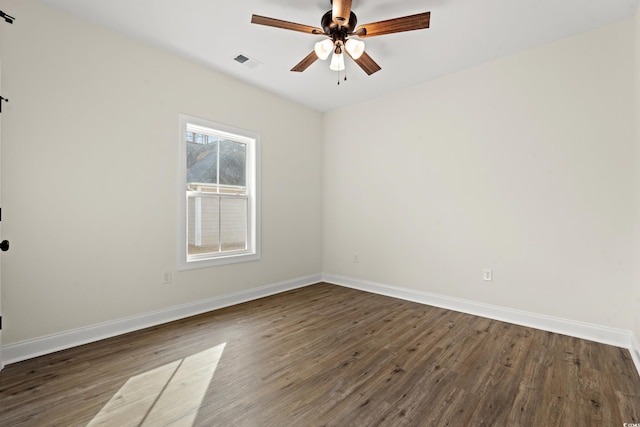 unfurnished room featuring ceiling fan and dark wood-type flooring