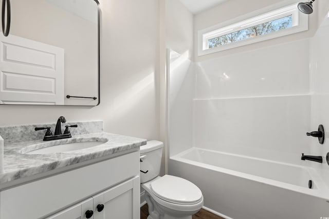 full bathroom featuring shower / washtub combination, vanity, and toilet