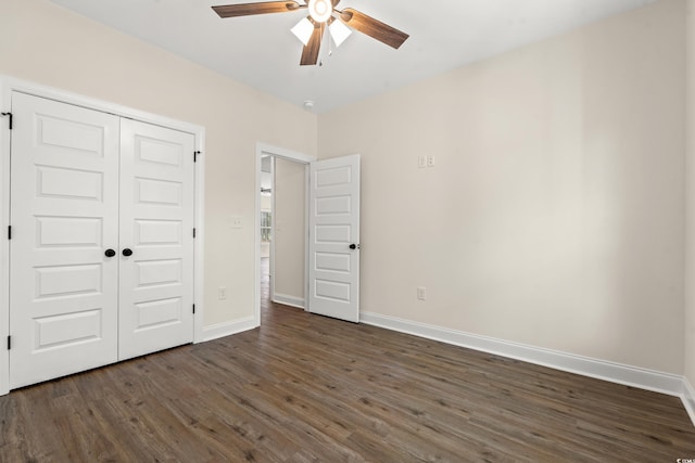 unfurnished bedroom featuring ceiling fan, a closet, and dark hardwood / wood-style floors