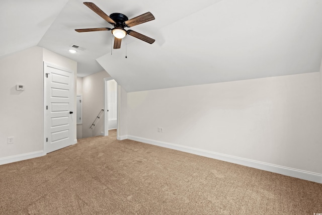 bonus room with ceiling fan, carpet floors, and vaulted ceiling