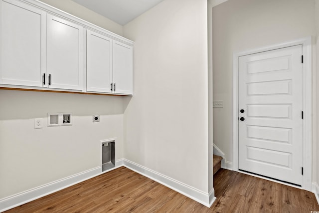 laundry room with cabinets, hookup for a washing machine, hardwood / wood-style flooring, and hookup for an electric dryer