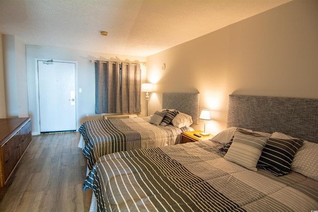 bedroom featuring dark wood-type flooring