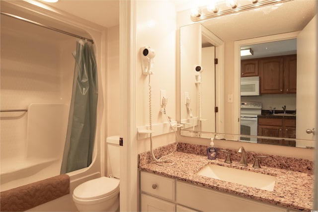 full bathroom featuring vanity, toilet, and shower / tub combo