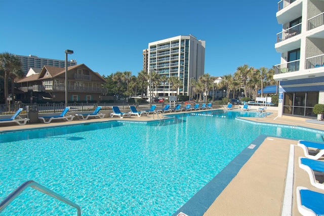 view of swimming pool featuring a patio area