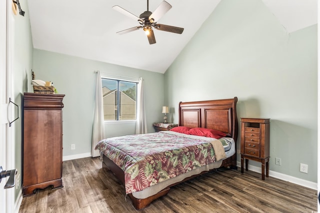 bedroom featuring ceiling fan, dark wood-type flooring, and vaulted ceiling