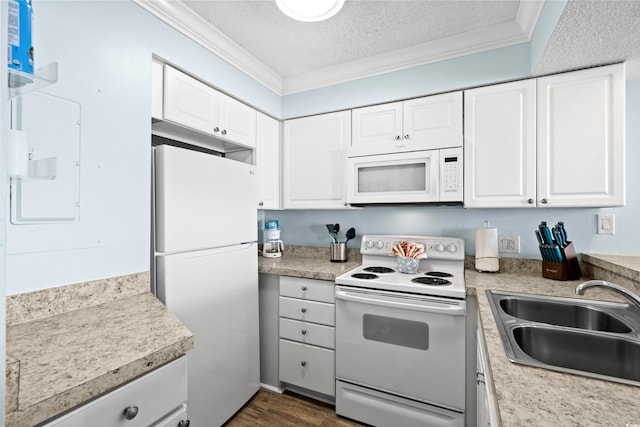 kitchen featuring a textured ceiling, white cabinetry, white appliances, and sink