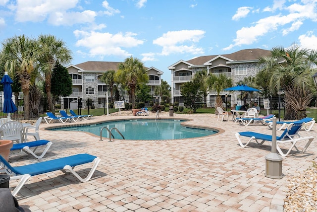 view of pool featuring a patio