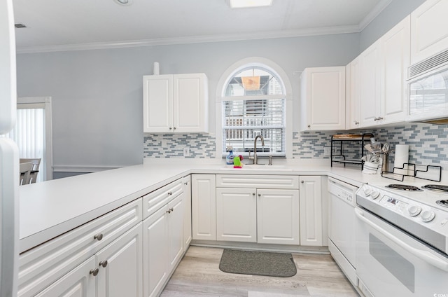 kitchen with white appliances, tasteful backsplash, white cabinetry, and ornamental molding