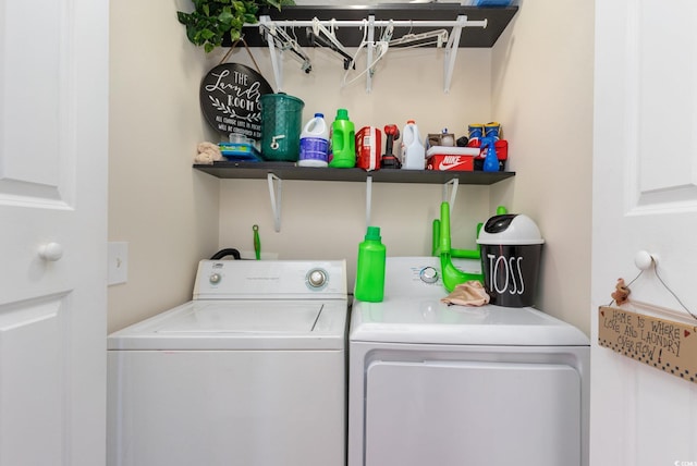 washroom with washing machine and clothes dryer