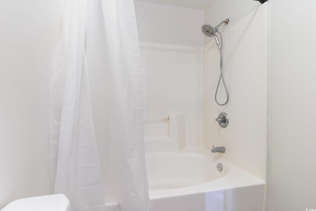 bathroom with shower / bathtub combination with curtain