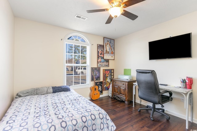 bedroom with dark hardwood / wood-style floors and ceiling fan