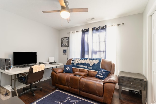 office with ceiling fan and dark hardwood / wood-style flooring