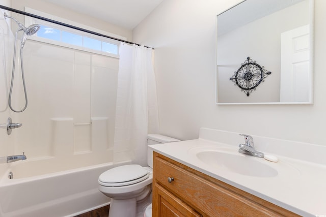 full bathroom featuring vanity, shower / bath combo, and toilet