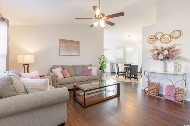 living room featuring dark wood-type flooring, vaulted ceiling, and ceiling fan