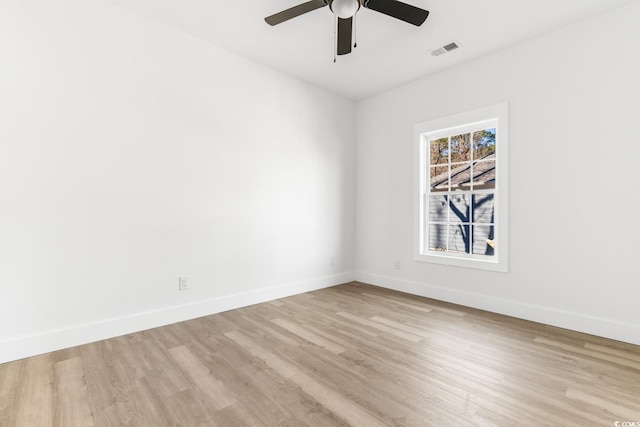 spare room featuring ceiling fan and light wood-type flooring