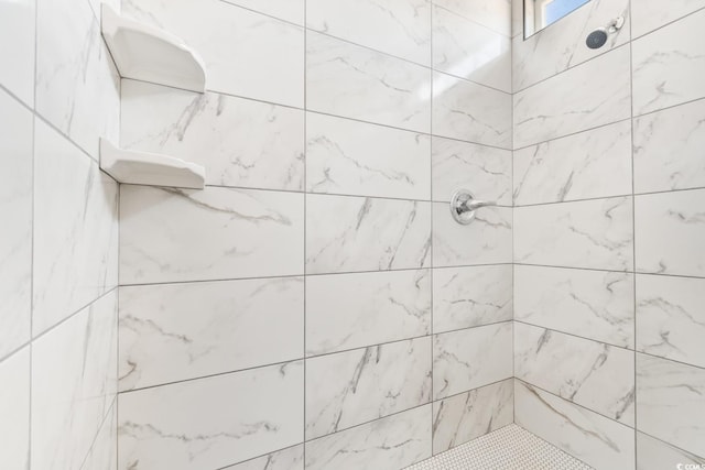 bathroom featuring tiled shower