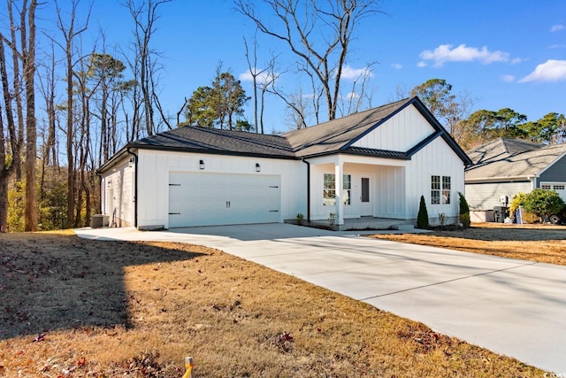 modern inspired farmhouse with covered porch and a garage